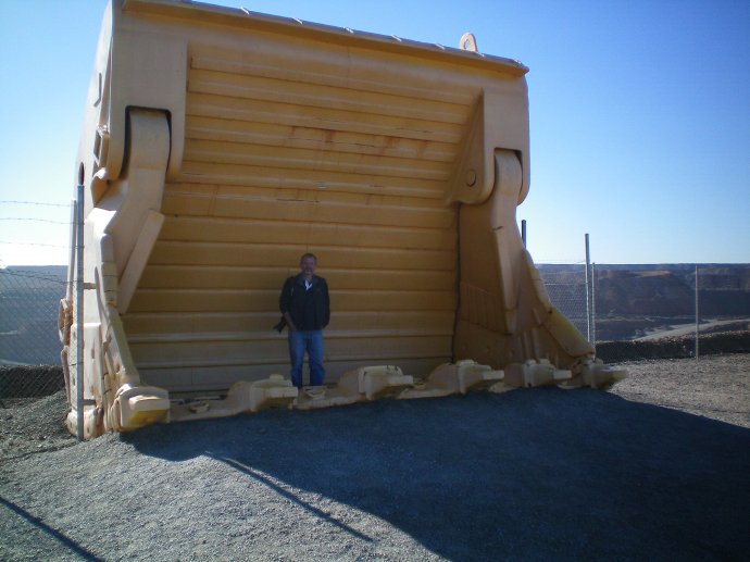 Tony standing in a face shovel which holds 60 tons per scoop