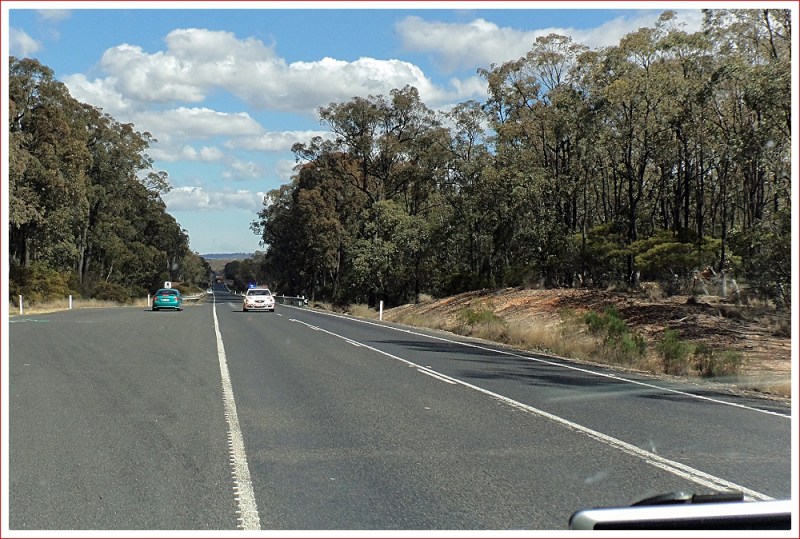 Police escort for extra wide load approaching